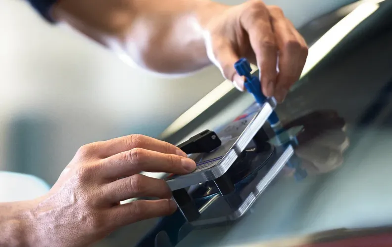Auto glass technicians at the Glass Inc shop on Glen Iris Drive